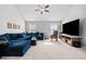 Spacious living room with vaulted ceilings, large sectional sofa, and large TV at 4046 Arnolds Mill Opas, Douglasville, GA 30135