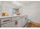 Bright bathroom features a double sink vanity, and warm tile flooring at 828 Royal Red Ct, Mcdonough, GA 30253