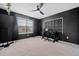Unique bedroom featuring black walls, soundproofing, and a dedicated workspace at 828 Royal Red Ct, Mcdonough, GA 30253
