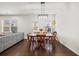 Charming dining area with a farmhouse table, neutral decor, and natural lighting at 828 Royal Red Ct, Mcdonough, GA 30253