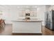 Spacious kitchen island with granite countertops and stainless steel appliances at 828 Royal Red Ct, Mcdonough, GA 30253