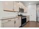 Close-up of the kitchen featuring granite counters, stainless steel appliances, and ample cabinet space at 828 Royal Red Ct, Mcdonough, GA 30253