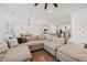 Open-concept living area showcases a spacious sectional sofa that flows into the kitchen at 828 Royal Red Ct, Mcdonough, GA 30253
