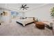 A serene main bedroom features a ceiling fan, ample natural light, and neutral tones at 828 Royal Red Ct, Mcdonough, GA 30253