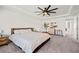 A main bedroom features a ceiling fan, ample natural light, and neutral tones at 828 Royal Red Ct, Mcdonough, GA 30253