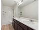 Bright bathroom featuring double sinks, a large mirror, and a shower-tub combination at 903 Hollytree Pl, Acworth, GA 30102