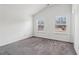 Bright bedroom features two windows offering lots of natural light and neutral carpeting at 903 Hollytree Pl, Acworth, GA 30102