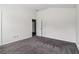 This bedroom features neutral carpeting, a large closet and bright white walls at 903 Hollytree Pl, Acworth, GA 30102