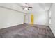Large bedroom with neutral carpet, ceiling fan and bathroom access at 903 Hollytree Pl, Acworth, GA 30102