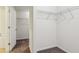 Walk-in closet offers ample storage space with shelving and neutral carpeting at 903 Hollytree Pl, Acworth, GA 30102