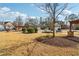 View of a community park area with covered pergolas, landscaping, and neighborhood homes at 903 Hollytree Pl, Acworth, GA 30102