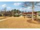 A well-maintained community park featuring picnic tables, trellises, and walking paths for residents to enjoy outdoor activities at 903 Hollytree Pl, Acworth, GA 30102