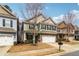 Two-story home with stone and siding, an attached two-car garage, and a manicured lawn at 903 Hollytree Pl, Acworth, GA 30102
