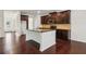 Spacious kitchen features an island, stainless steel appliances and dark wood cabinets at 903 Hollytree Pl, Acworth, GA 30102