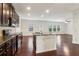 Stylish kitchen featuring dark cabinets, granite countertops, and an open floor plan at 903 Hollytree Pl, Acworth, GA 30102
