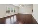 Spacious living room with hardwood floors, a ceiling fan, and ample natural light at 903 Hollytree Pl, Acworth, GA 30102
