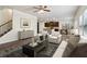 Cozy living room with hardwood floors, comfortable seating, and seamless flow to the kitchen at 903 Hollytree Pl, Acworth, GA 30102
