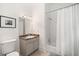 Bathroom featuring a single vanity, a granite countertop, and a shower-tub combo provides a functional design at 1181 Lanier Ne Blvd, Atlanta, GA 30306