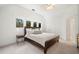 Bright bedroom featuring a king-sized bed, large windows, and a neutral color palette with an ensuite bathroom at 1181 Lanier Ne Blvd, Atlanta, GA 30306