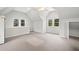 Bright bedroom offering natural light, neutral paint and carpet, and a ceiling fan for added comfort at 1181 Lanier Ne Blvd, Atlanta, GA 30306