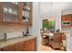 Dining area features a granite table, wicker chairs, and natural lighting at 1181 Lanier Ne Blvd, Atlanta, GA 30306