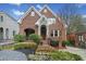 Charming brick home with stone archway, manicured landscaping and inviting front entrance at 1181 Lanier Ne Blvd, Atlanta, GA 30306