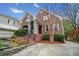 Charming brick home showcasing stone accents, landscaped gardens, and a welcoming front porch at 1181 Lanier Ne Blvd, Atlanta, GA 30306