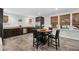 Modern kitchen with stainless steel appliances, dark cabinetry, and a charming dining area for casual meals at 1181 Lanier Ne Blvd, Atlanta, GA 30306