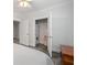 View into a compact laundry closet featuring a stacked washer and dryer for convenient in-home laundry at 1181 Lanier Ne Blvd, Atlanta, GA 30306