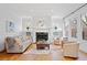 Bright living room with hardwood floors, fireplace, white trim and windows at 1181 Lanier Ne Blvd, Atlanta, GA 30306