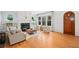 Bright living room with fireplace, hardwood floors, and large windows offering natural light at 1181 Lanier Ne Blvd, Atlanta, GA 30306