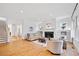 Bright living room with hardwood floors, fireplace, white trim and staircase at 1181 Lanier Ne Blvd, Atlanta, GA 30306