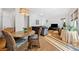 Open concept living room adjacent to dining space, featuring hardwood floors at 1181 Lanier Ne Blvd, Atlanta, GA 30306