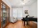 Study featuring French doors, a piano, lots of natural light and hardwood floors at 1181 Lanier Ne Blvd, Atlanta, GA 30306