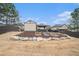 Backyard featuring mulched area with stone accents and a shed, providing a serene outdoor space at 1695 Stone Meadow Rd, Lithonia, GA 30058