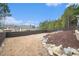Backyard with a privacy fence and mulched area, creating a serene outdoor space at 1695 Stone Meadow Rd, Lithonia, GA 30058