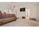 Large bedroom with vaulted ceiling, ceiling fan and an open door to another room at 1695 Stone Meadow Rd, Lithonia, GA 30058