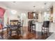 Open-concept dining area flows into a modern kitchen with a breakfast bar at 1695 Stone Meadow Rd, Lithonia, GA 30058