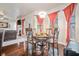 Charming dining area with hardwood floors, modern lighting, and comfortable seating at 1695 Stone Meadow Rd, Lithonia, GA 30058