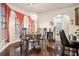 Inviting dining area with hardwood floors, modern light fixture and natural light at 1695 Stone Meadow Rd, Lithonia, GA 30058