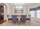 Elegant dining room with stylish chandelier, tray ceilings, and bright windows at 1695 Stone Meadow Rd, Lithonia, GA 30058