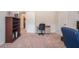 Home office with desk, swivel chair, and a bookshelf for storage at 1695 Stone Meadow Rd, Lithonia, GA 30058