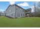 Large backyard with a well-maintained lawn, spacious patio, and outdoor seating area for entertainment at 430 Parkbrook Way, Canton, GA 30114