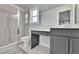 Well-lit bathroom with glass-enclosed shower, gray vanity, and modern fixtures at 430 Parkbrook Way, Canton, GA 30114