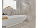 Luxury bathroom with a freestanding tub and seamless glass shower enclosure at 430 Parkbrook Way, Canton, GA 30114