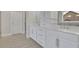 Elegant bathroom features double vanity with white cabinets and modern chrome fixtures at 430 Parkbrook Way, Canton, GA 30114