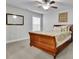 Cozy bedroom featuring a wood sleigh bed, ceiling fan, and natural light at 430 Parkbrook Way, Canton, GA 30114