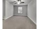 Spacious bedroom with neutral carpeting, a ceiling fan, and natural light at 430 Parkbrook Way, Canton, GA 30114