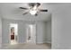 Bright and airy bedroom with ceiling fan, connecting doors and neutral carpeting at 430 Parkbrook Way, Canton, GA 30114
