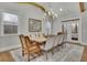 Traditional dining room featuring a chandelier, natural light and seating for eight guests at 430 Parkbrook Way, Canton, GA 30114
